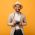 guy-in-beige-suit-and-hat-posing-with-retro-camera-C9CTR6W.jpg